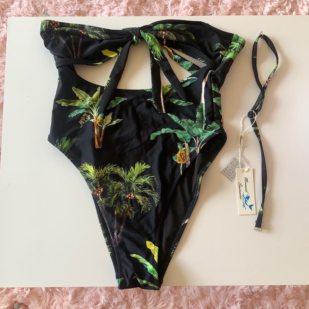 One Piece black bathing suit with green palm trees